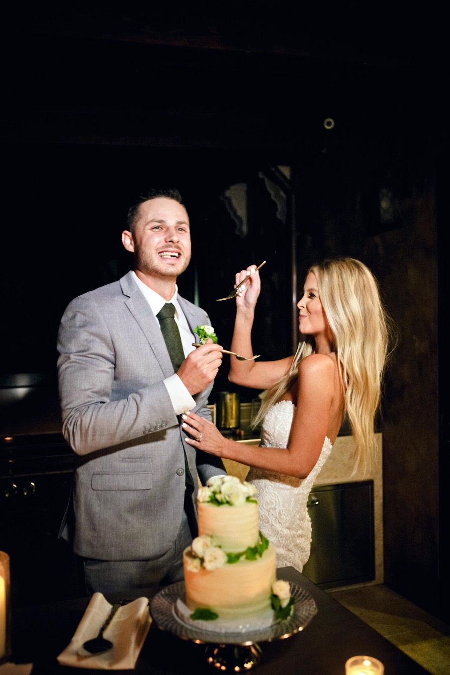 bride and groom eating cake