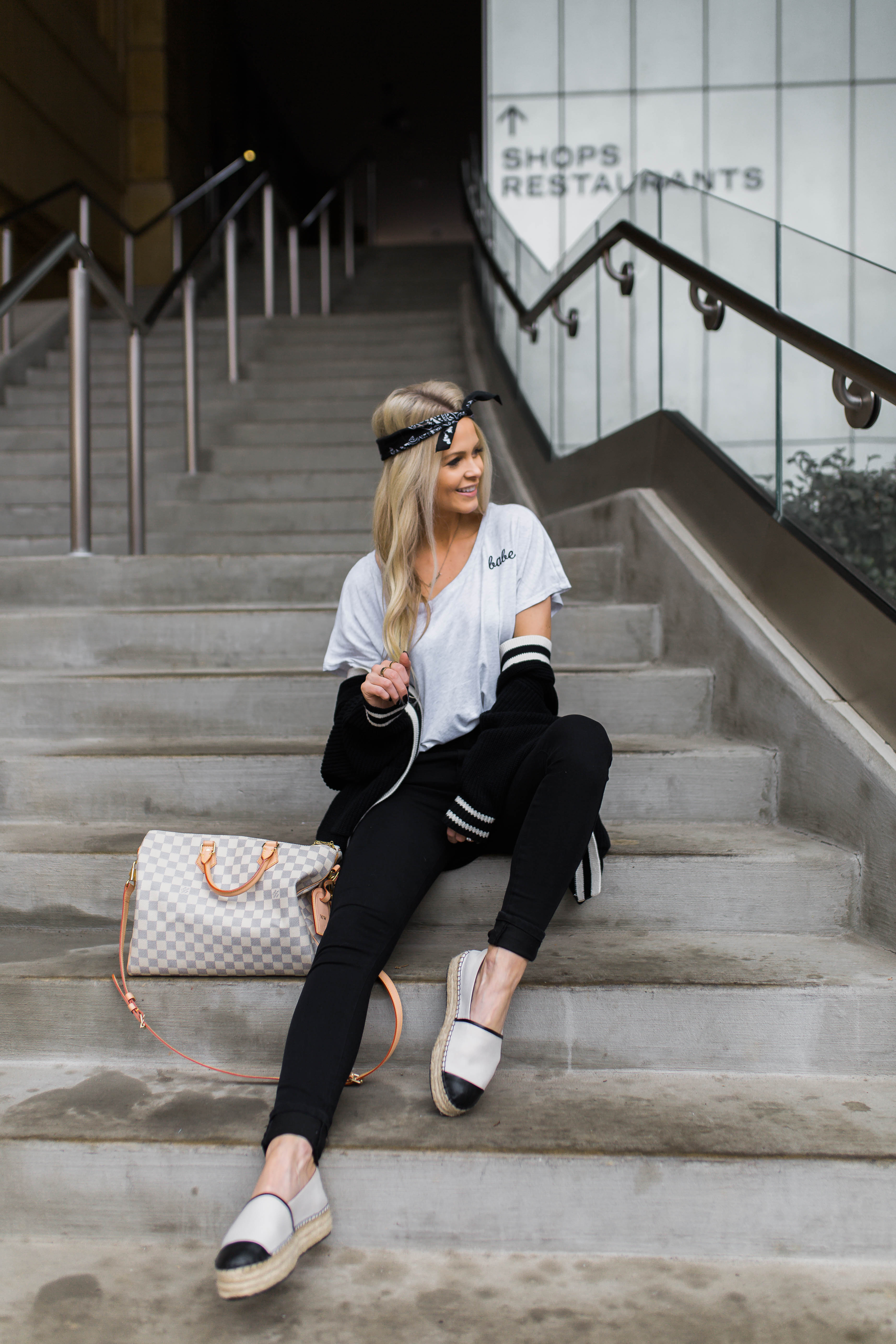 blogger on stairs pose