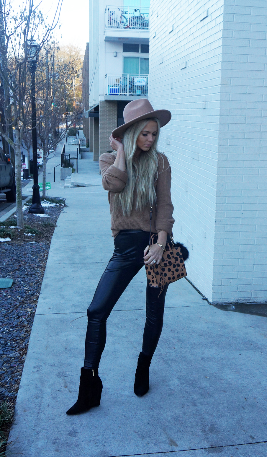 camel sweater, leather leggings